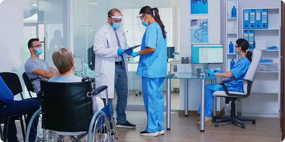 Healthcare infrastructure image showing a modern clinic or hospital exterior, representing improved health services.