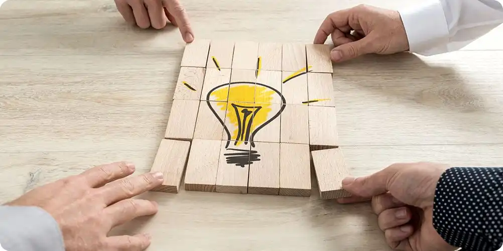 Innovation challenges image featuring a glowing lightbulb surrounded by gears and creative icons on a dark background, representing inventive problem-solving.