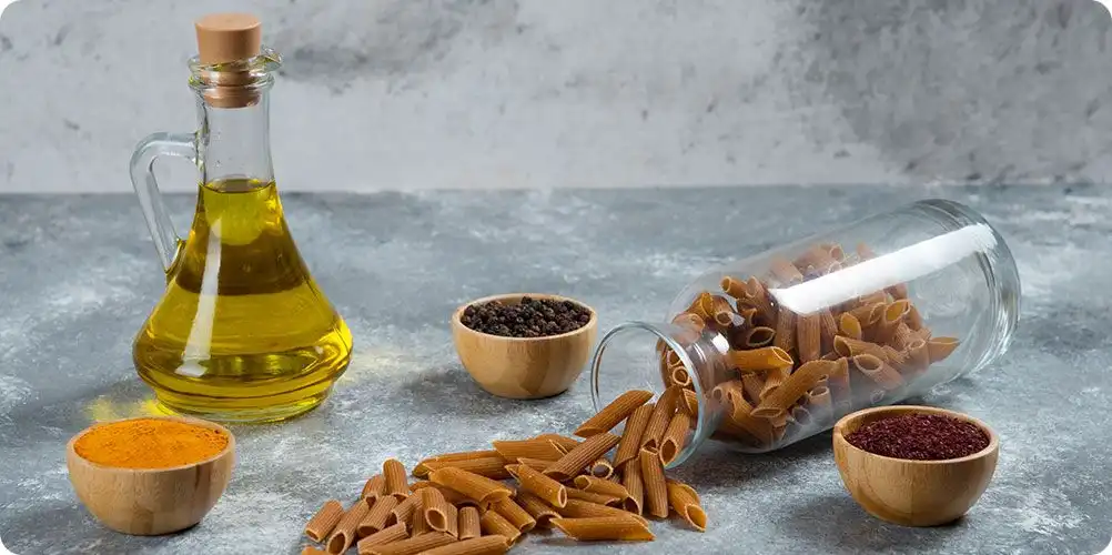 A photo of whole spices like black pepper or chilies next to a viscous, dark liquid oleoresin, representing concentrated flavor and color.