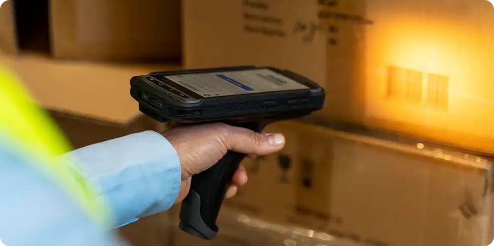 Order processing image featuring workers packaging products on a conveyor belt in a fulfillment center.
