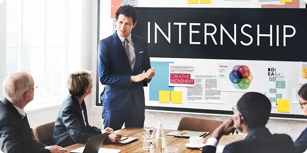 Hand holding a human-shaped vector graphic similar to the first, emphasizing internship or career development programs.