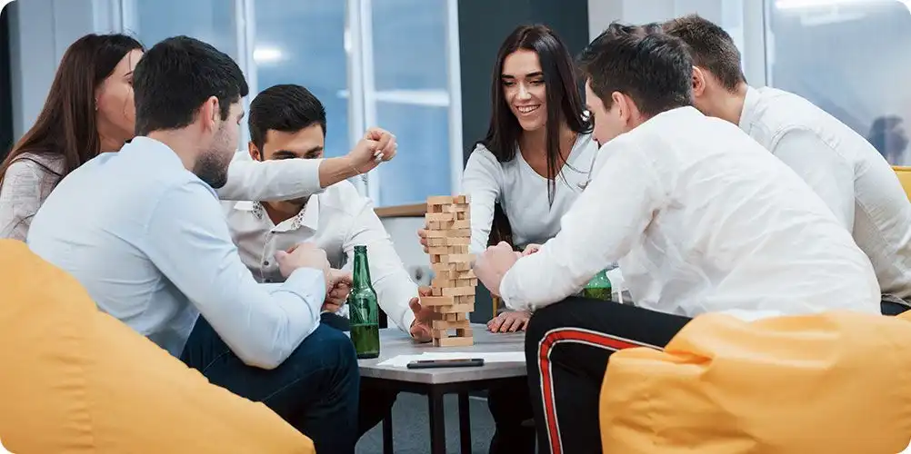 Synthite Speak internal communication initiative banner with employees participating in a discussion forum or company meeting, highlighting open dialogue and employee engagement.