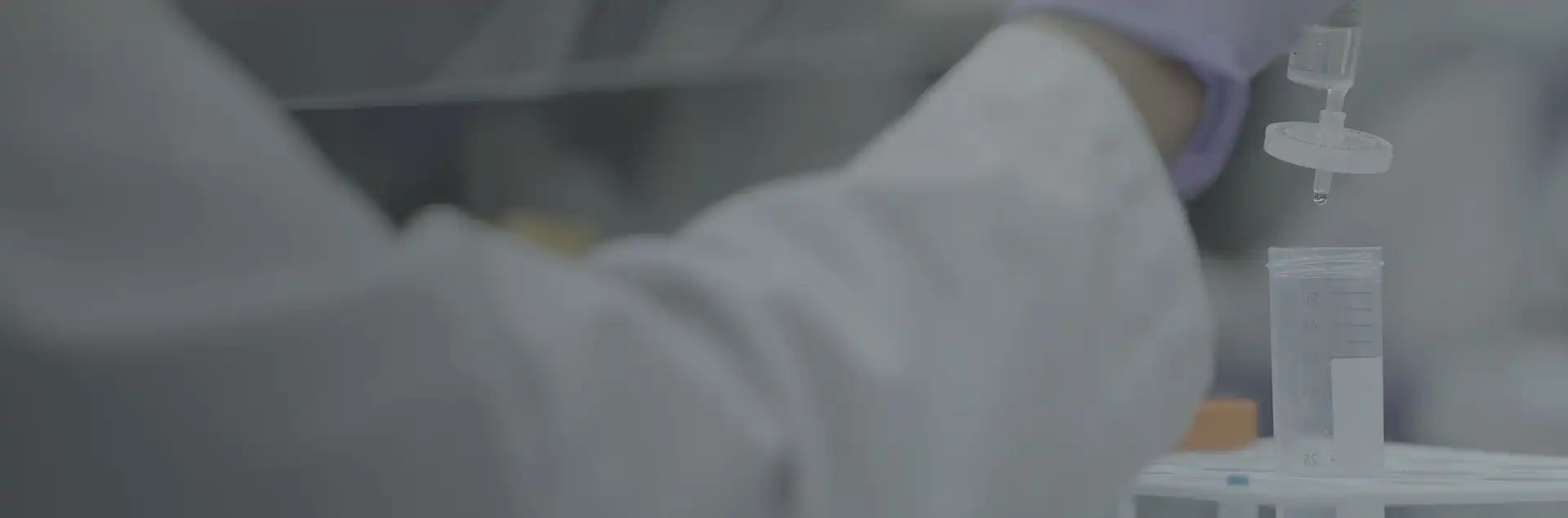 Research collaboration banner showing diverse professionals around a conference table discussing documents and laptops, symbolizing teamwork and knowledge exchange.