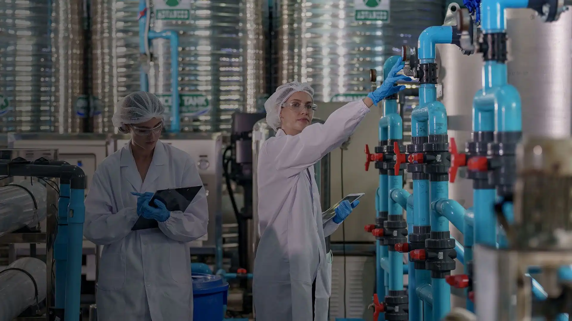 Capabilities and services banner showing professionals in a modern industrial lab with advanced equipment, desktop version.