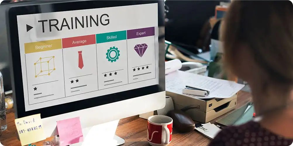 Conference room with professionals engaged in discussion, illustrating graduate programs or corporate meetings.